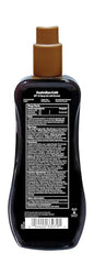 Aplicación del Spray Gel Bronzer de Australian Gold para un bronceado rápido.