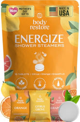 Body Restore bombas de ducha cítricas en empaque, ideal para empezar un ritual de relajación diario.