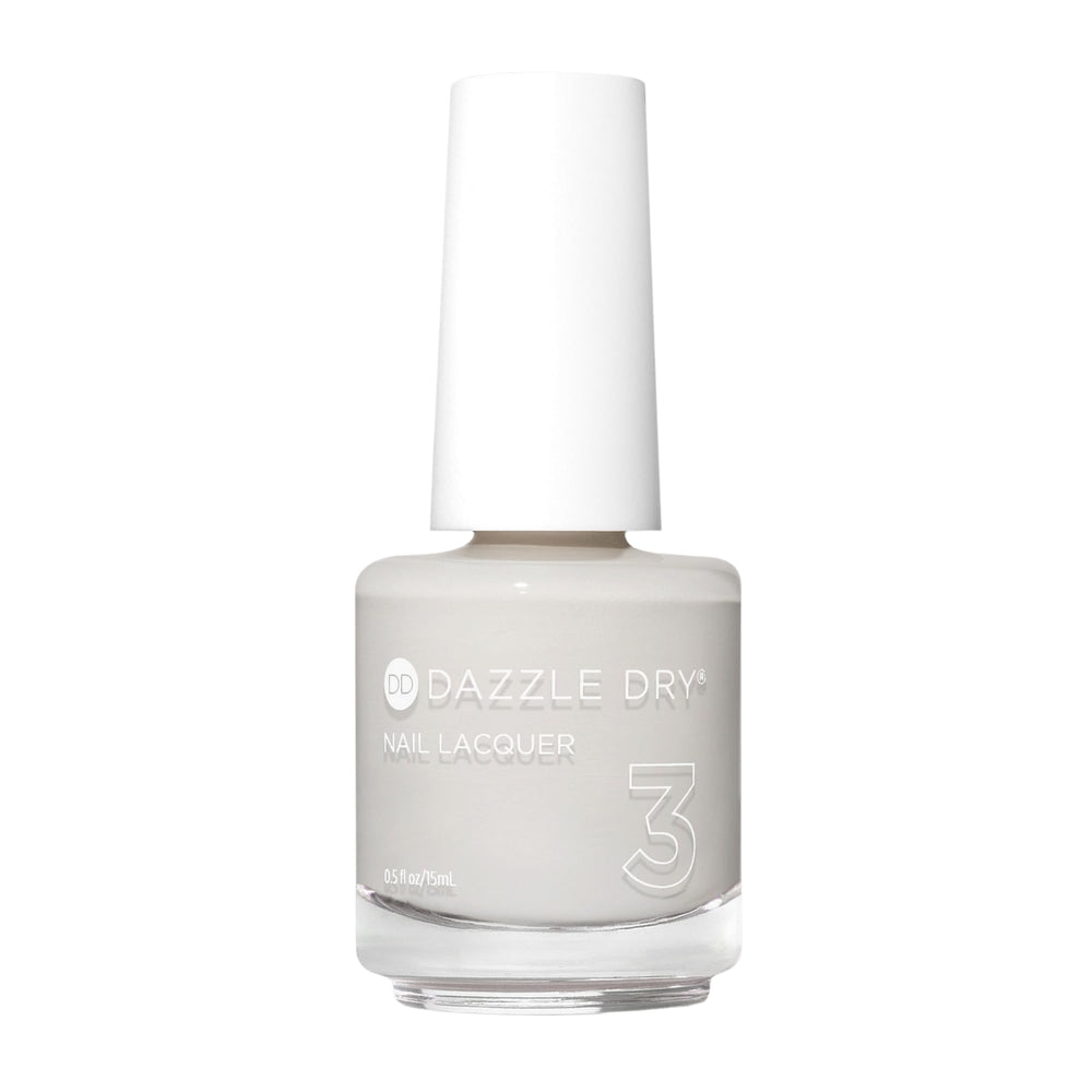 Dazzle Dry Esmalte Step 3 en tono blanco calido, cubre uñas con acabado uniforme.