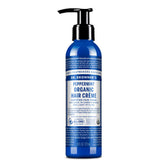 Dr. Bronner's crema capilar orgánica en botella, hidratación suave y brillo natural.