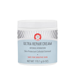 First Aid Beauty Crema Ultra Repair en envase y tapa, hidratación prolongada.