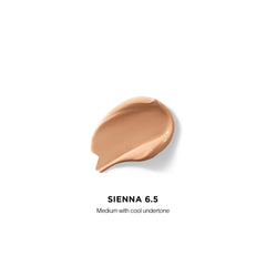 Hourglass Vanish Airbrush Concealer textura cremosa que se difumina con facilidad.