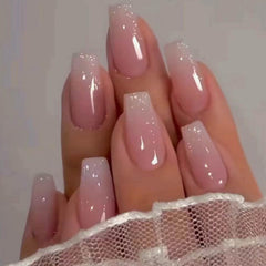 Uñas JingleFancy forma ataúd con brillo gradiente rosado, look glamoroso para ocasiones.