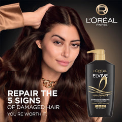 L'Oréal Paris Elvive Total Repair 5, aplicación en mano para uso diario.