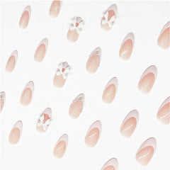 LRKNNO uñas almendra rosado neutro con lazo, ideal para fiestas y bodas.