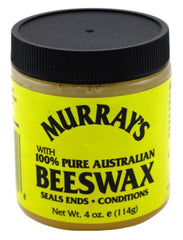 Aplicación suave de Murray's Cera de Abeja en el cabello para peinado definido.