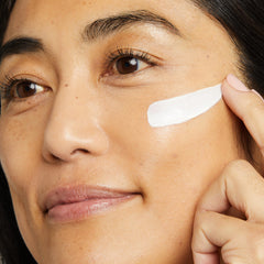 Texture close-up of No7 Restore & Renew cream showing rich, silky hydration