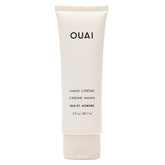 Crema de manos OUAI, aplicación densa para hidratación rápida.