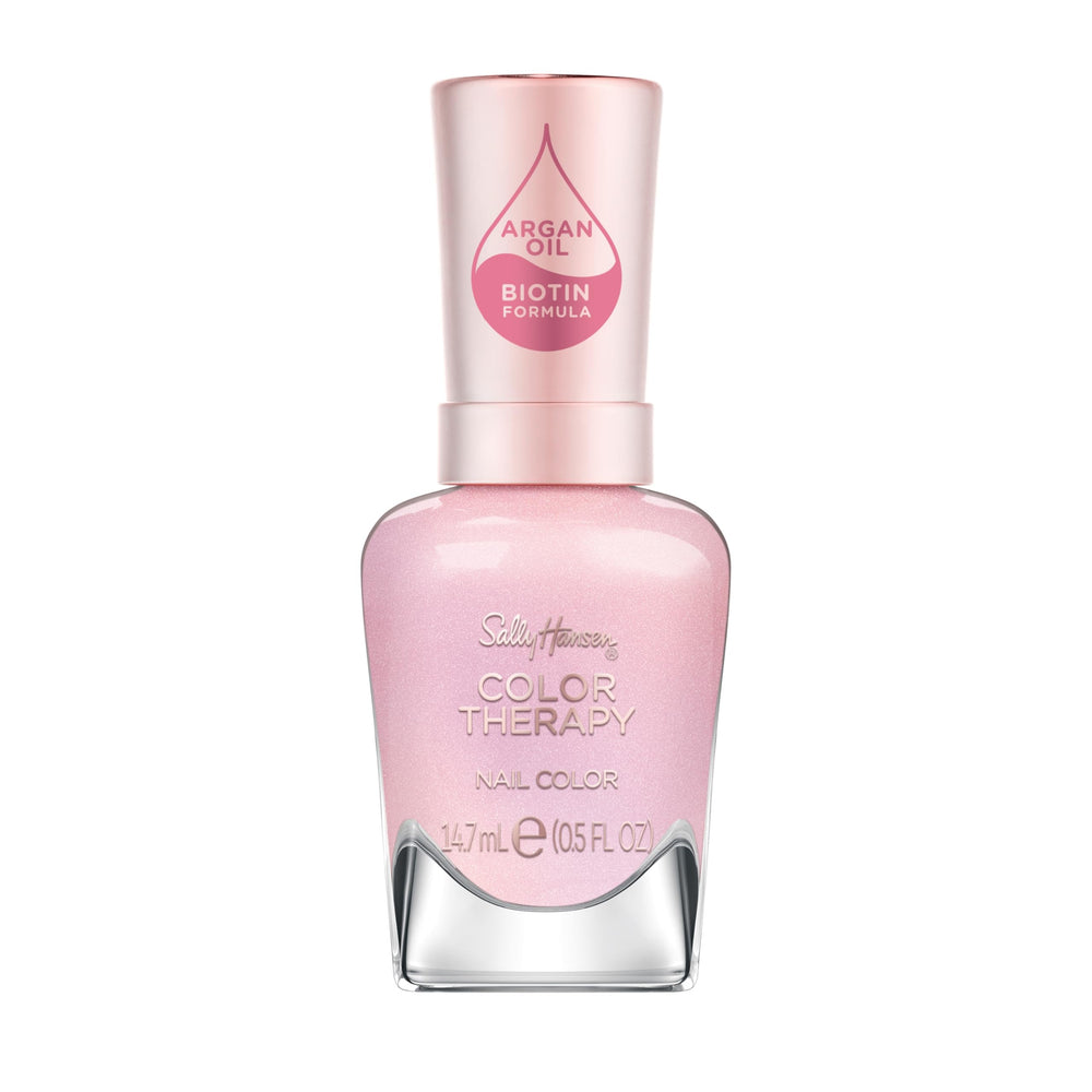 Esmalte Sally Hansen Color Therapy Staycation, botella rosa para un look de salón en casa.