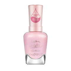 Esmalte Sally Hansen Color Therapy Staycation, botella rosa para un look de salón en casa.