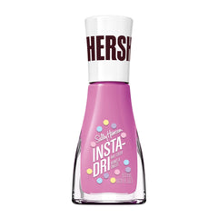 Botella Sally Hansen Insta-Dri en rosa purpura, secado rápido para manicuras rápidas.