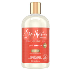 SheaMoisture champú estiramiento de rizos; botella con textura cremosa y aroma tropical.