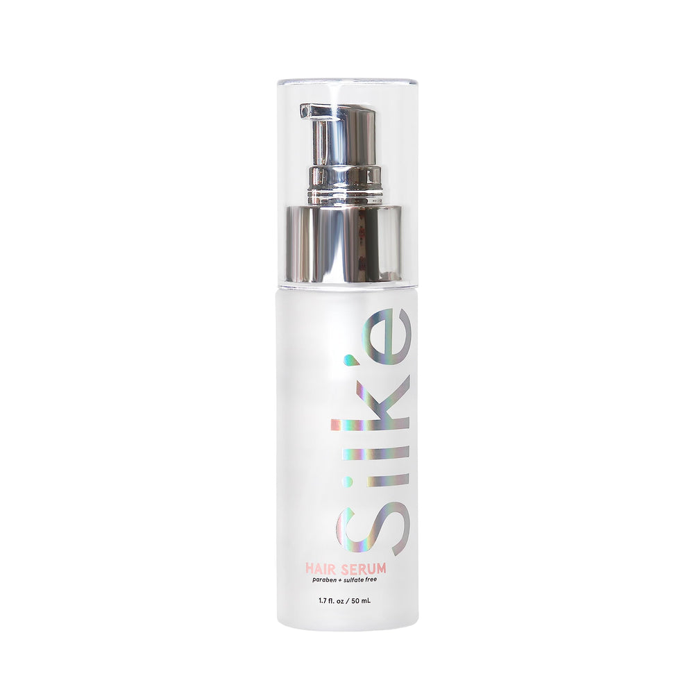 Sleek'e Silk'e Serum: botella con acabado sedoso para cabello suave.