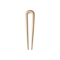 The Hair Edit Sleek Chignon Pin con acabado dorado suave para fijar peinados diarios con elegancia.