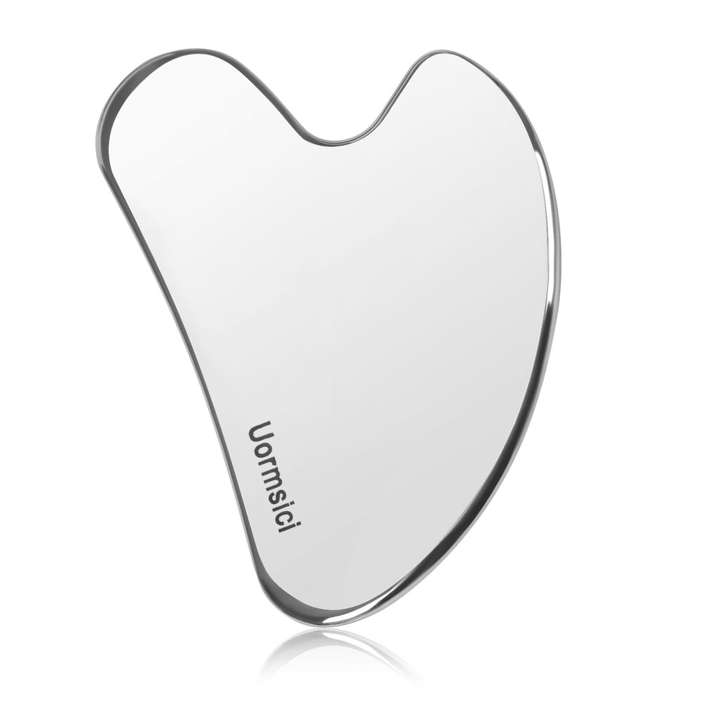 Uormsici Gua Sha de metal frente: ayuda a tensar la piel con uso regular.