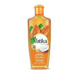 Vatika Naturals Dabur: botella con almendra para nutrición capilar y brillo.