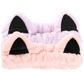 Diadema Waliah con orejas de gato rosa y morado, ideal para sujetar el cabello durante el lavado facial.