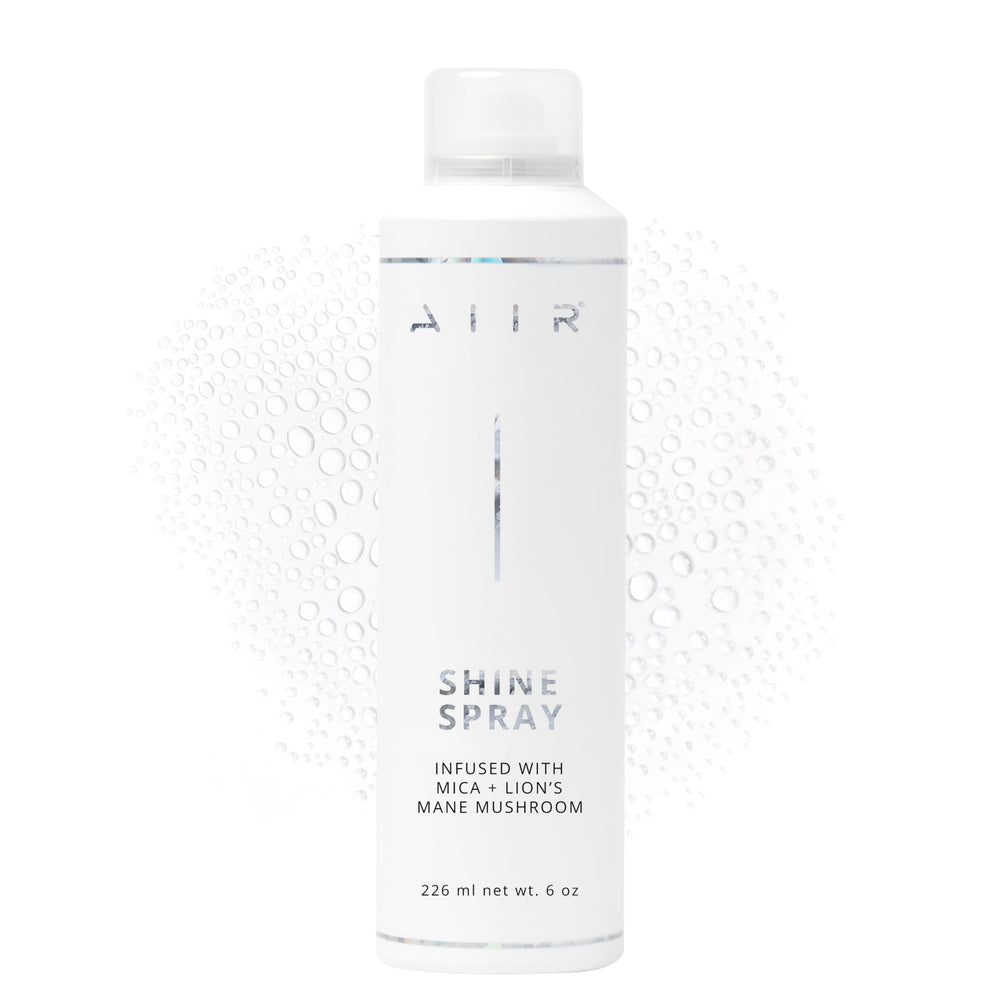 AIIR Shine Spray, botella brillante para un acabado luminoso y suave.