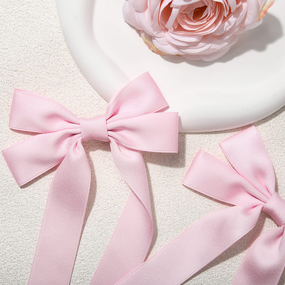 Accesorio de cabello de AILEAM, lazo satinado rosa para looks refinados.