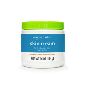 Crema hidratante Amazon Basics en bote de 16 onzas para piel seca y sensible.