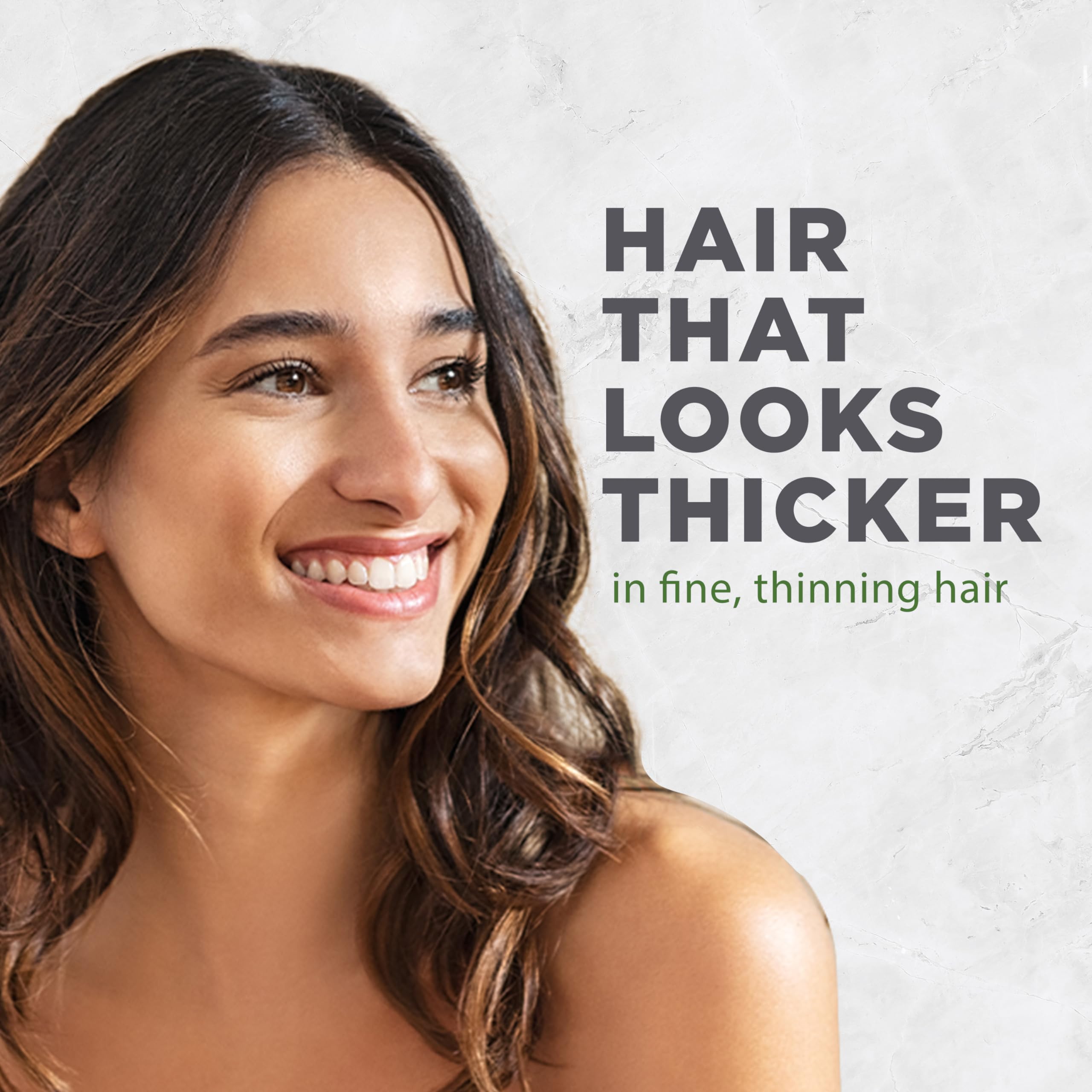 Textura crema del acondicionador Avalon Organics Biotin B-Complex en la palma