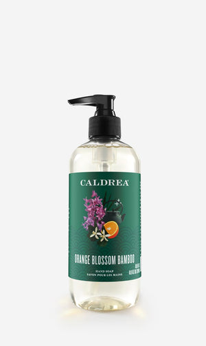 Caldrea jabón de manos Naranja Bambú: botella derramando para limpieza suave y aromática.