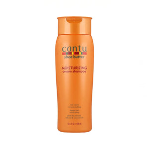 Cantu champú crema manteca de karité en frasco para hidratación suave y brillo.