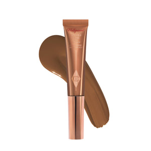Charlotte Tilbury Hollywood Contorno Líquido con aplicador cushion para definir pómulos con precisión.