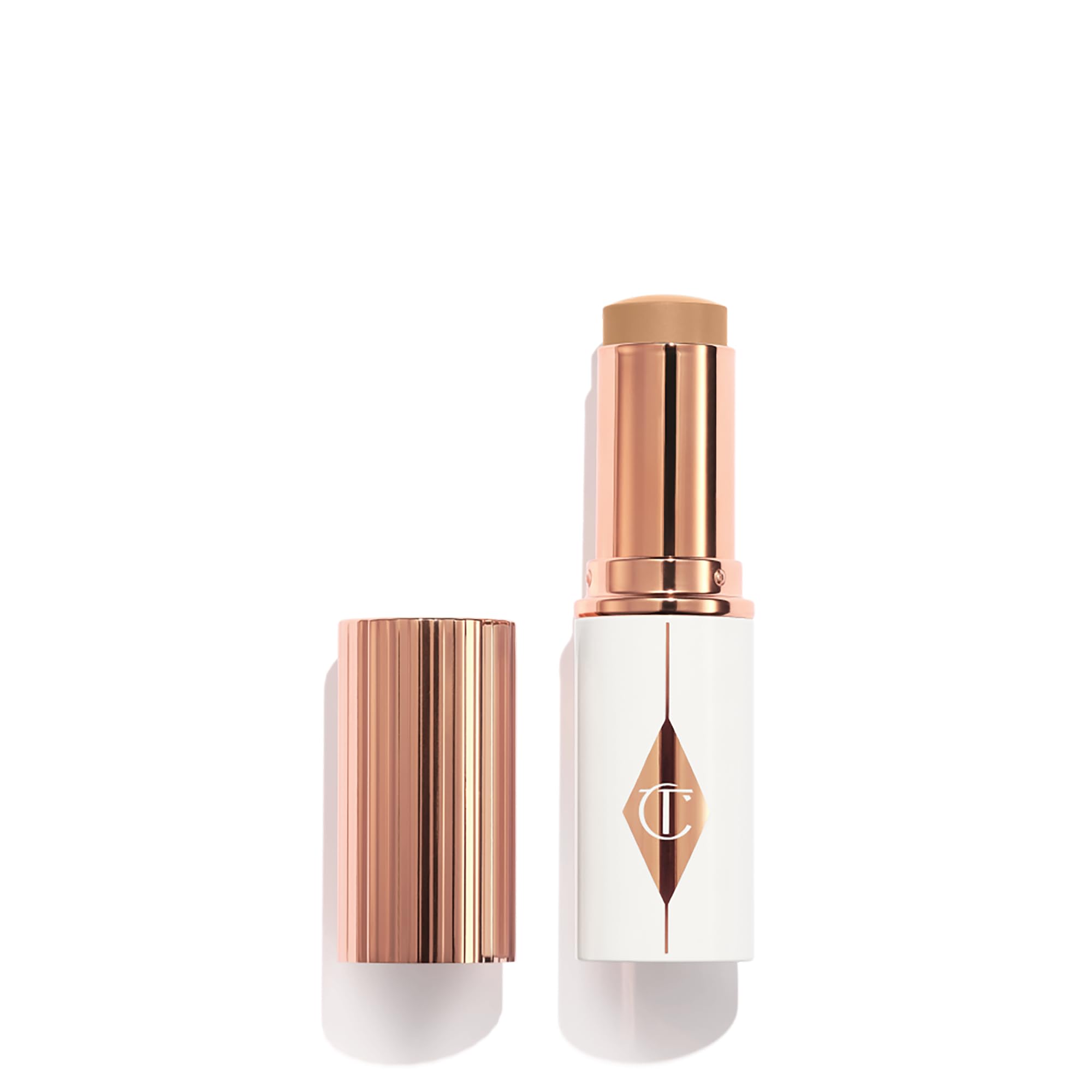 Charlotte Tilbury Unreal Skin Tint barra-aplicación crea acabado suave y natural.