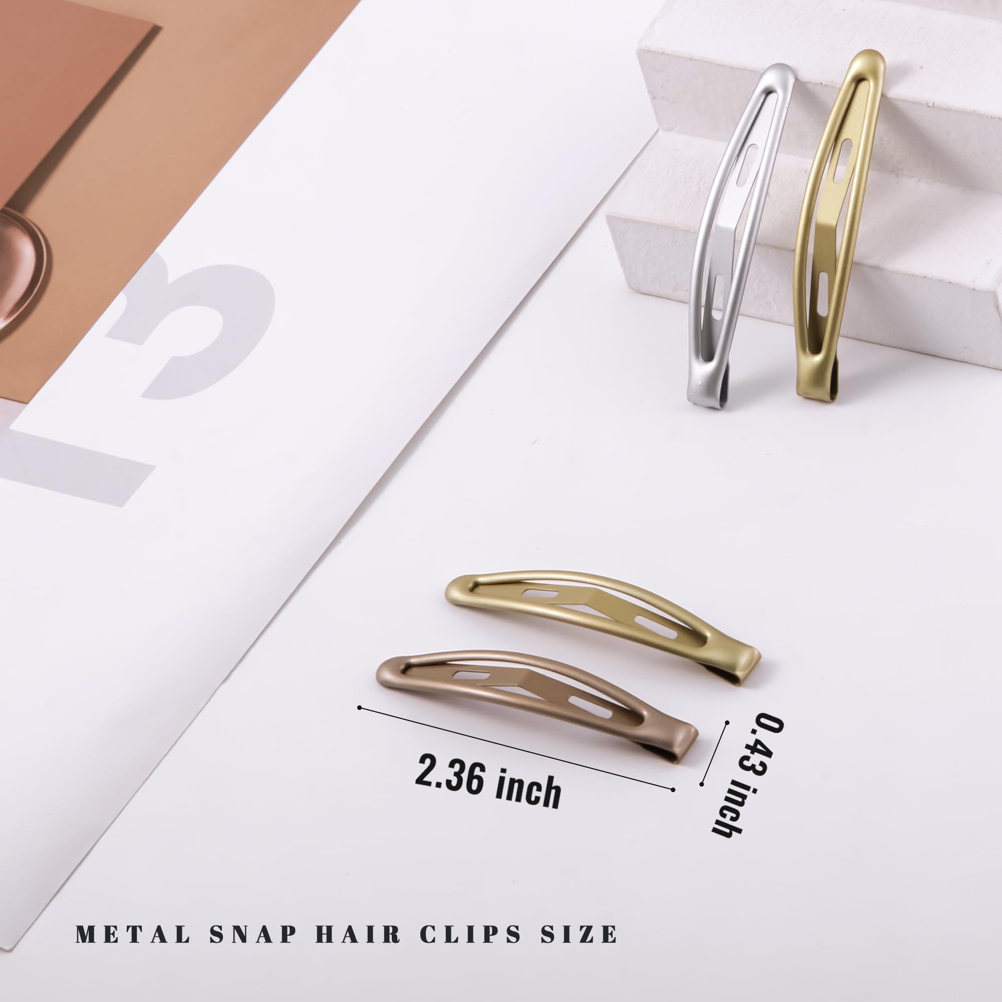 Pinzas Cptots de metal en oro con acabado brillante para estilos diarios.