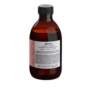 Davines Alchemic Champú Cobre, botella vertida, realza tonalidades cobres naturales