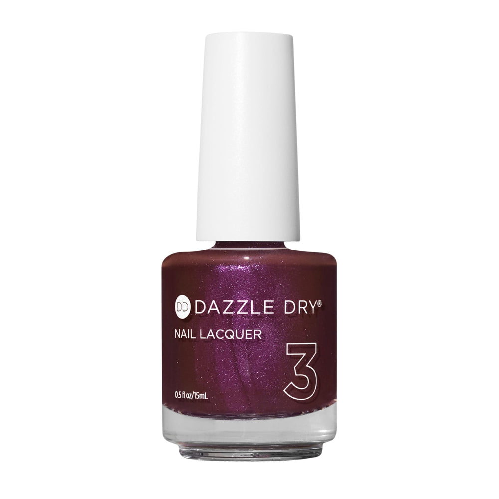 Dazzle Dry Spiced Plum: botella mostrando color profundo con brillo rosado.