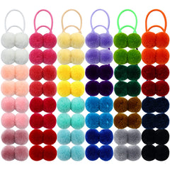 Dizila pompones colores dulces en paquete, ideales para peinados infantiles.