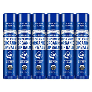 Balsamo labial Dr. Bronner's con menta para labios secos en envase compacto.