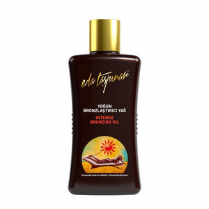 Botella del aceite bronceador intenso de Eda Taşpınar para un bronceado rápido y duradero.