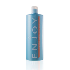 Champú Enjoy hidratante en envase de 33 oz, cabello suave y manejable.