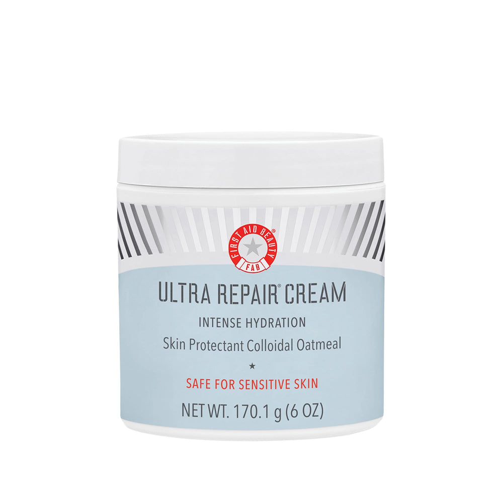 First Aid Beauty Crema Ultra Repair en envase y tapa, hidratación prolongada.