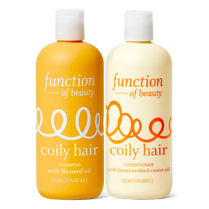 Function of Beauty Coily Champú botella: definición de rizos e hidratación diaria.