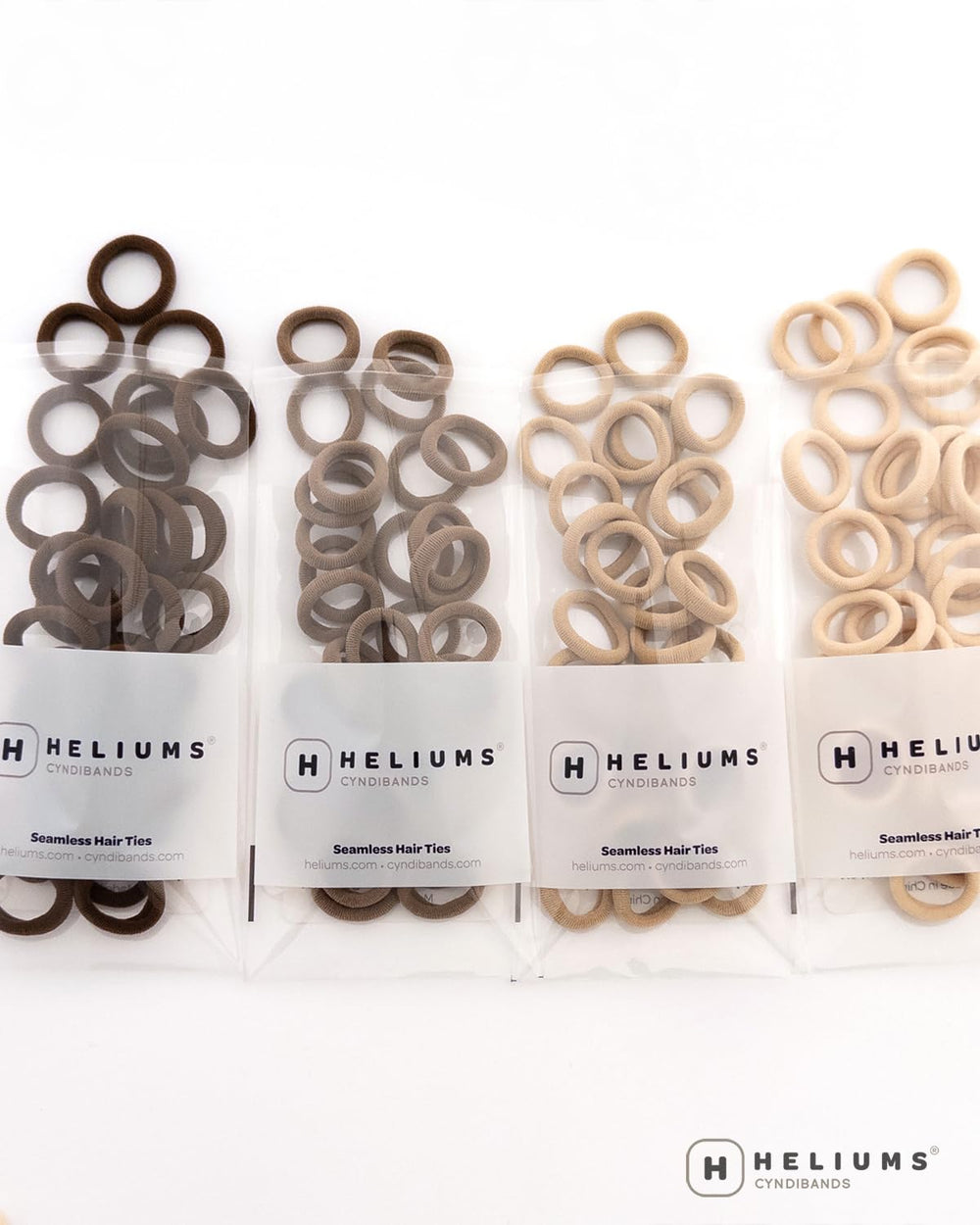Gomas Heliums para cabello delicado, perfectas para peinados seguros y cómodos.