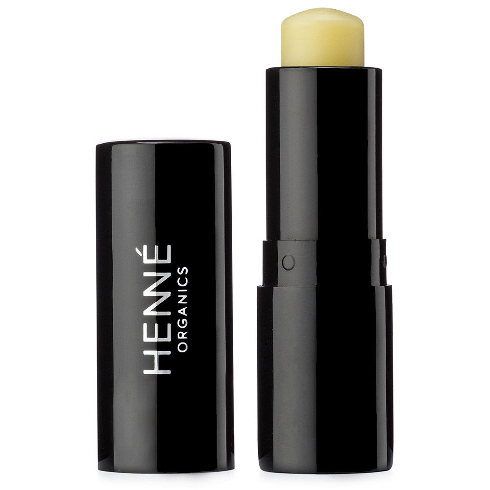 Henné Organics Labial Balm V2 en envase negro metálico, hidratación diaria suave y lujosa.