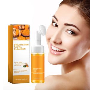 HuaQing Glow Wash Turmeric, botella y cepillo para exfoliación suave y limpieza profunda.