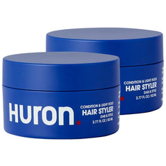Huron crema-peinado Citrus-Madera: envase compacto para peinados diarios con acabado natural.