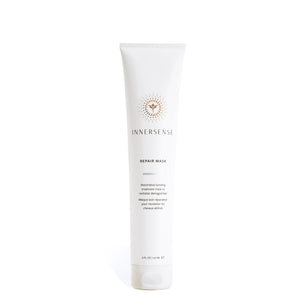 INNERSENSE Mascarilla Reparadora, botella vertiendo para tratamiento capilar.
