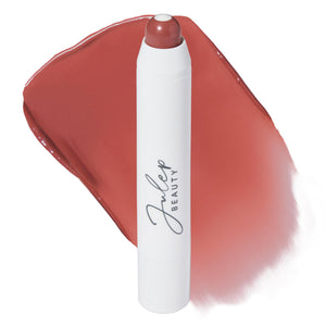 Julep bálsamo color Canela Pasas en empaque para viaje práctico