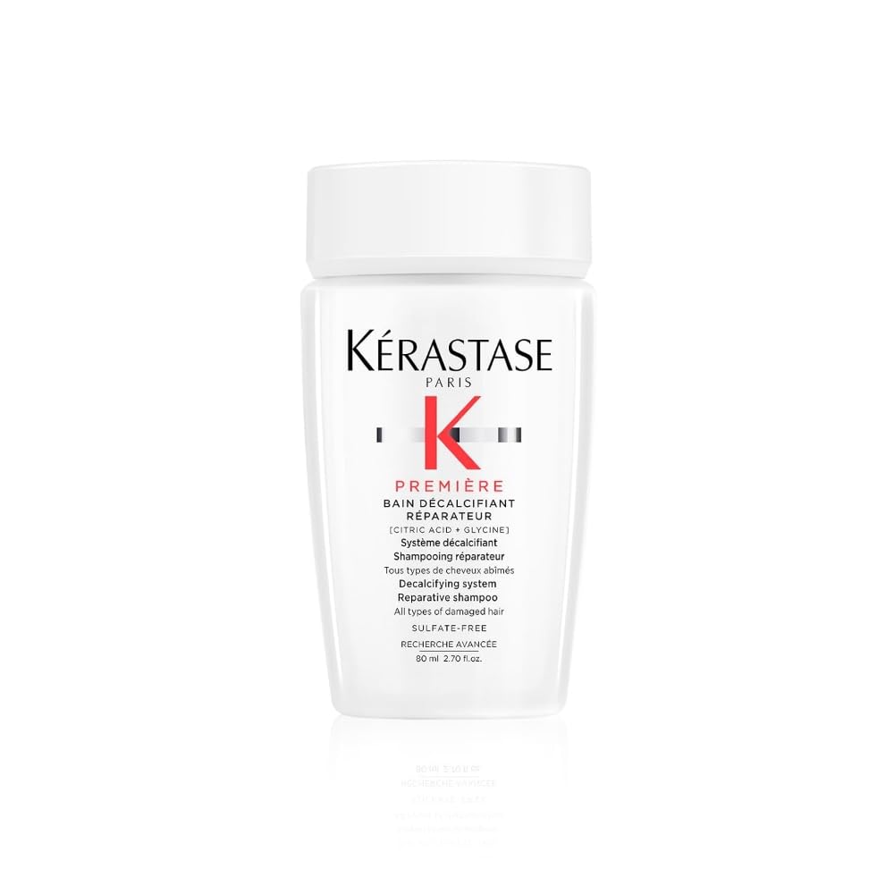 KÉRASTASE Premiere champú reparador sin sulfatos, botella visible para uso diario suave.