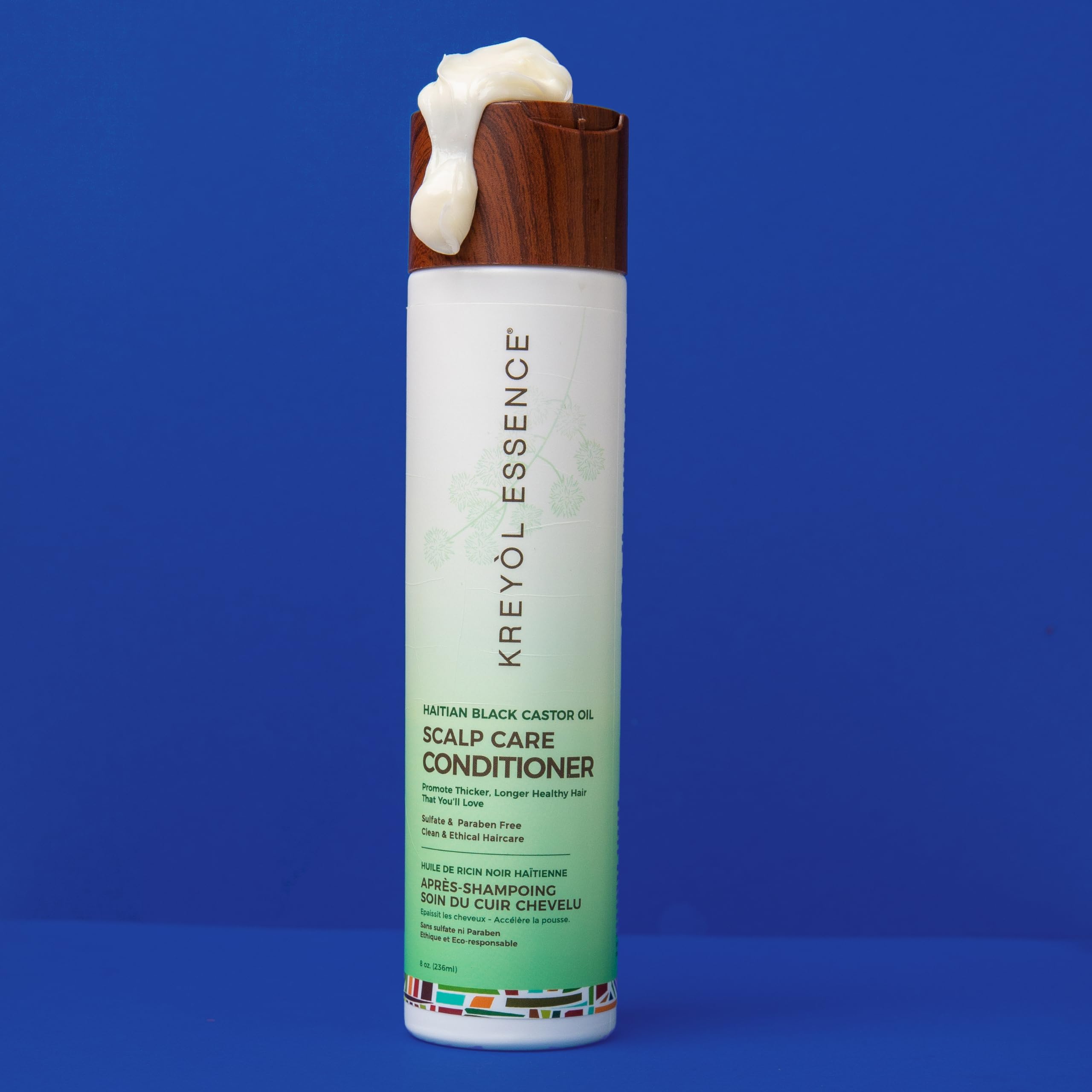 Acondicionador Kreyol Essence, cuidado integral del cabello para mayor fuerza.