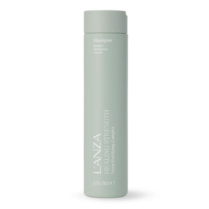 L’ANZA Healing Strength Shampoo en botella fortalece cabello débil y aporta brillo suave.