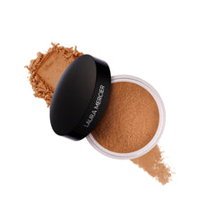 Laura Mercier polvo translúcido en botella para fijar maquillaje y controlar el brillo