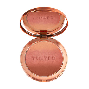 Live Tinted Huebeam Jumbo gradiente bronceador rosado para un resplandor natural.