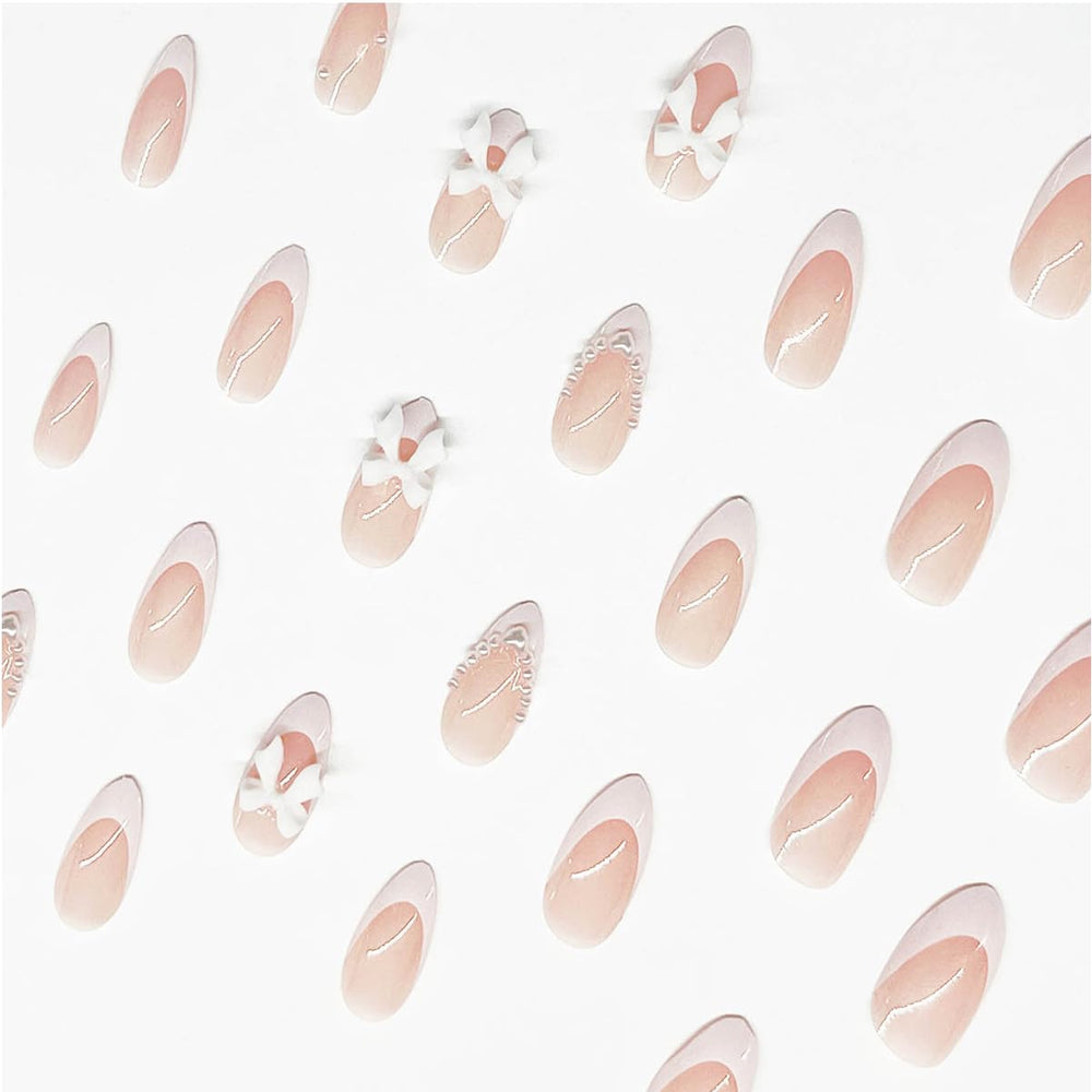 LRKNNO uñas almendra rosado neutro con lazo, ideal para fiestas y bodas.